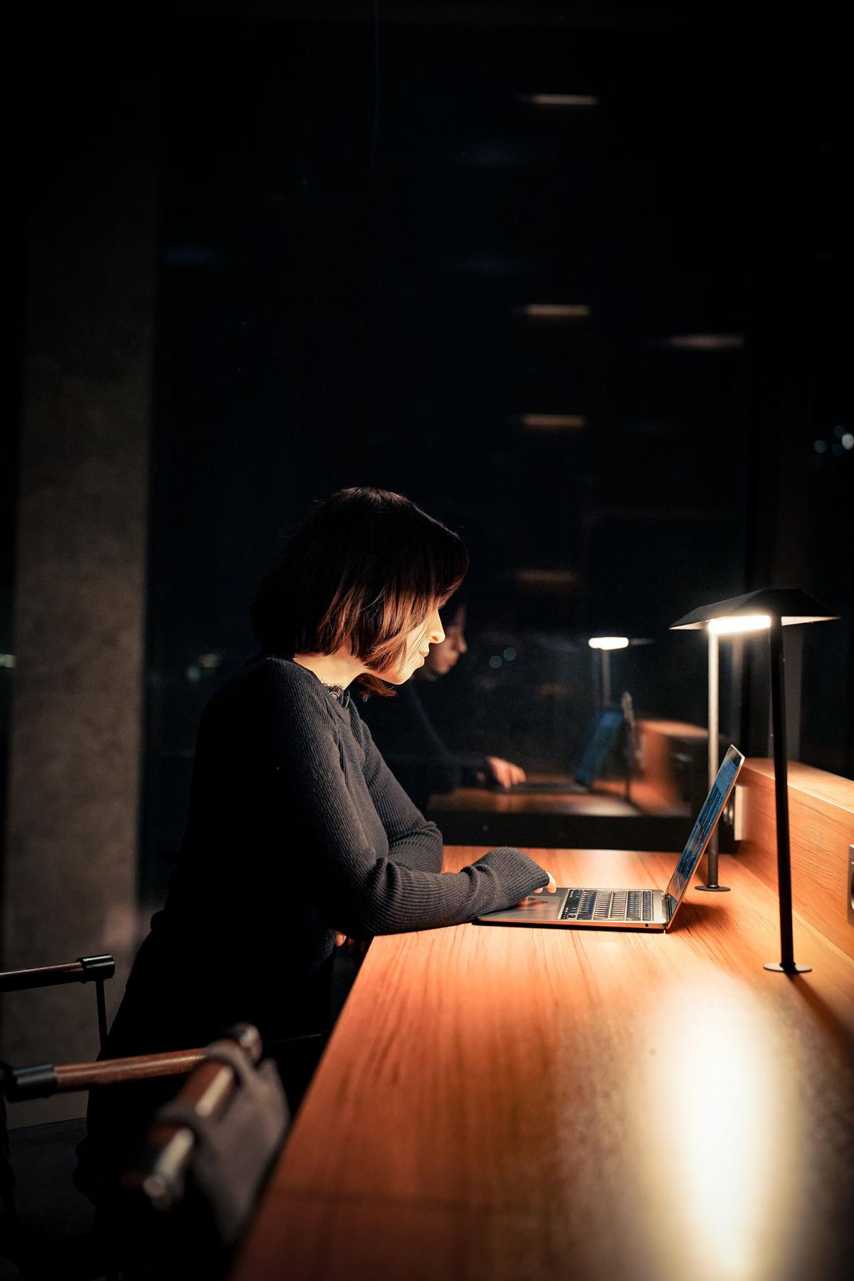 Marketing analyst reviewing a live campaign performance dashboard at night